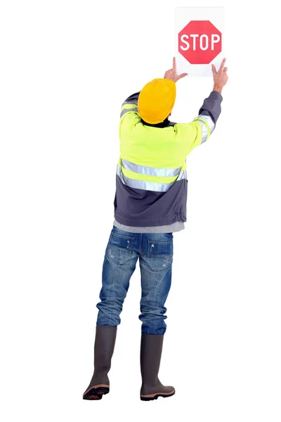 Pracownik z znak stop — Zdjęcie stockowe