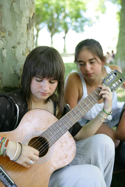 Kid with guitar in the park — Stock Photo, Image