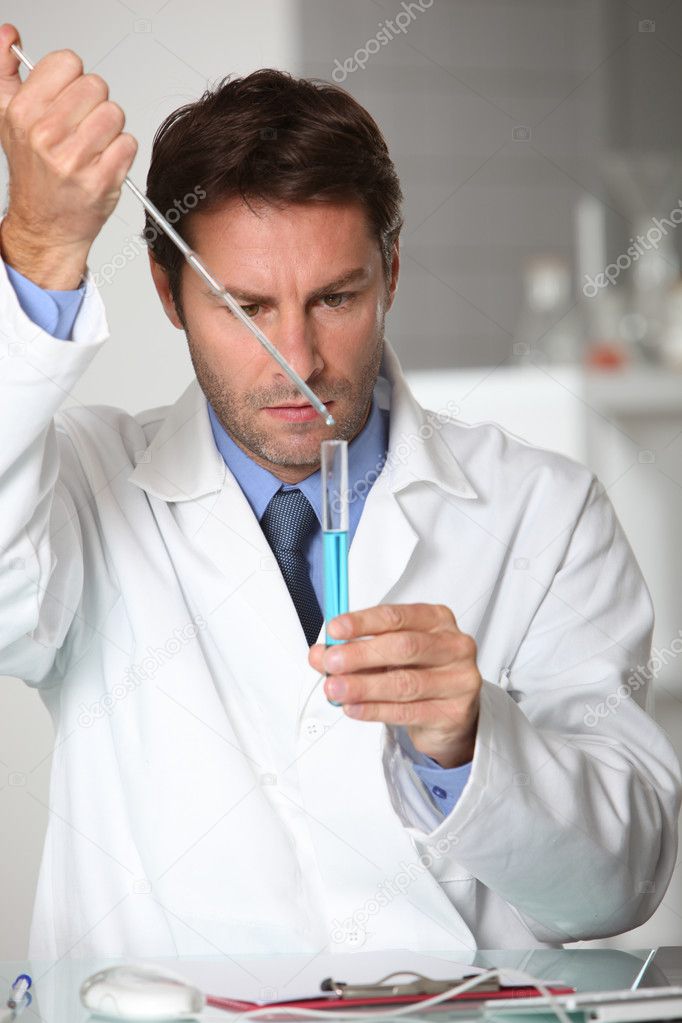 Laboratory technician working with a test tube — Stock Photo