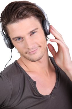 Young man listening music clipart