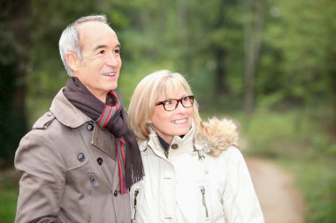 Couple on an autumn stroll clipart