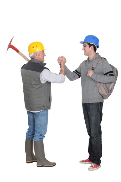 Worker greeting apprentice — Stock Photo, Image