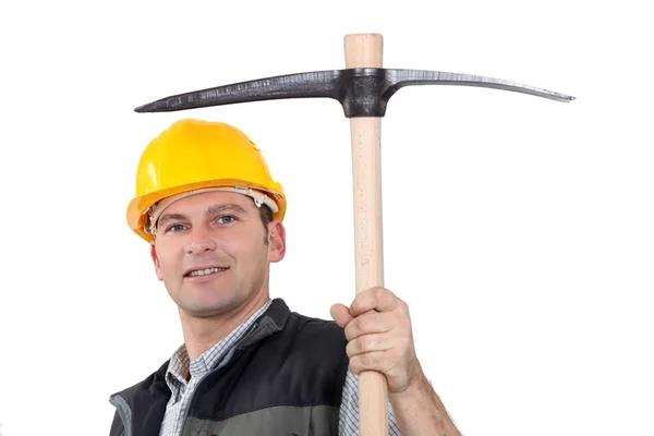 Man proudly displaying pick-axe — Stock Photo, Image