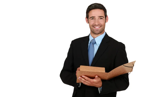 Счастливый бизнесмен держит папку — стоковое фото