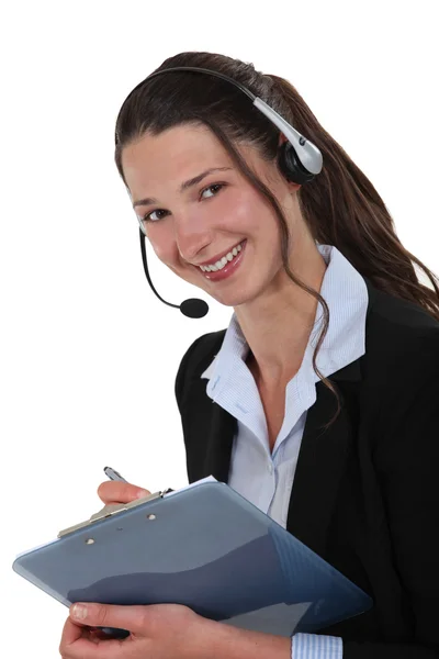 Glada callcenter handledare med clip-board — Stockfoto