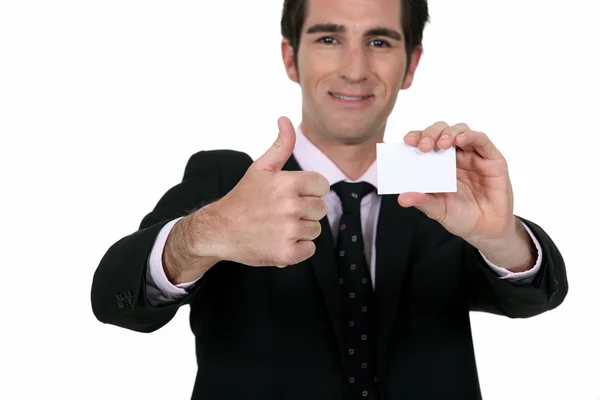 Happy businessman with card — Stock Photo, Image