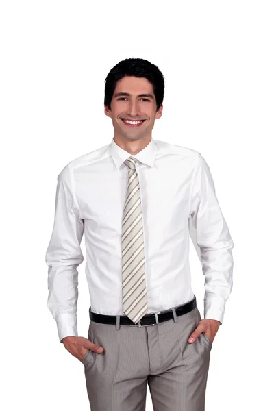 Confident businessman with hands in pockets — Stock Photo, Image