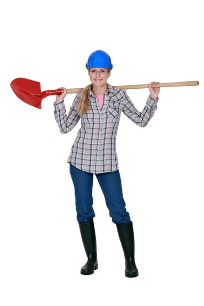 Woman with a shovel — Stock Photo, Image