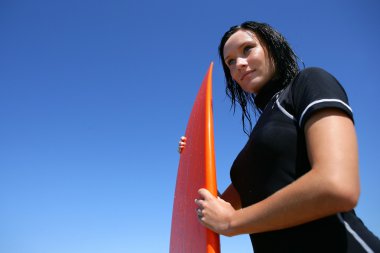 Woman with a surfboard clipart