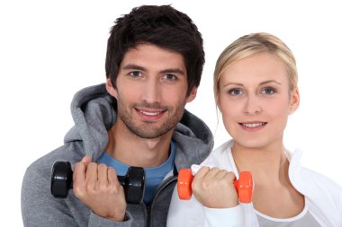 Couple lifting weights clipart