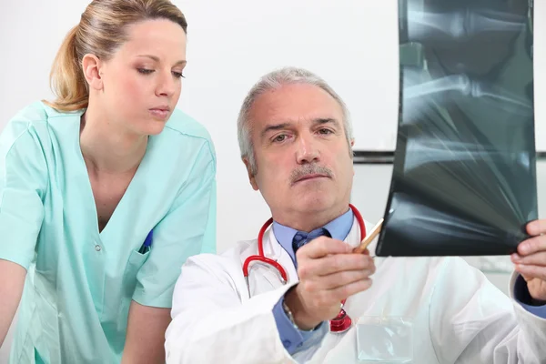 Radiologist and his assistant — Stock Photo, Image