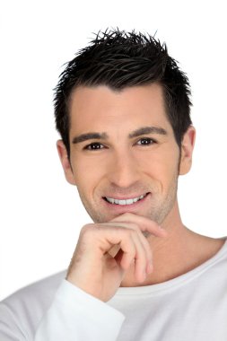 Man smiling with his hand on his chin clipart
