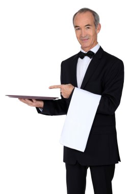 60 years old waiter showing his trail clipart