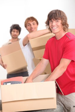 Trio of flat mates moving in together clipart