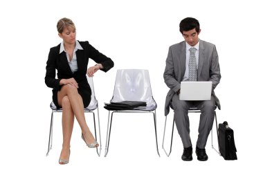 Two businesspeople waiting clipart