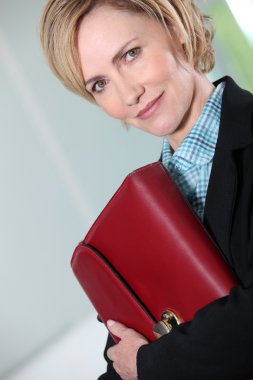 Businesswoman holding briefcase. clipart