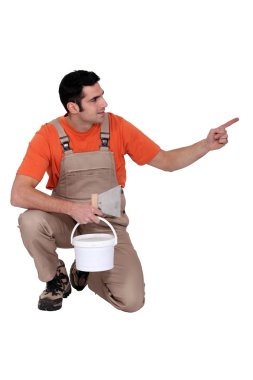 Painter facing and pointing sideways clipart