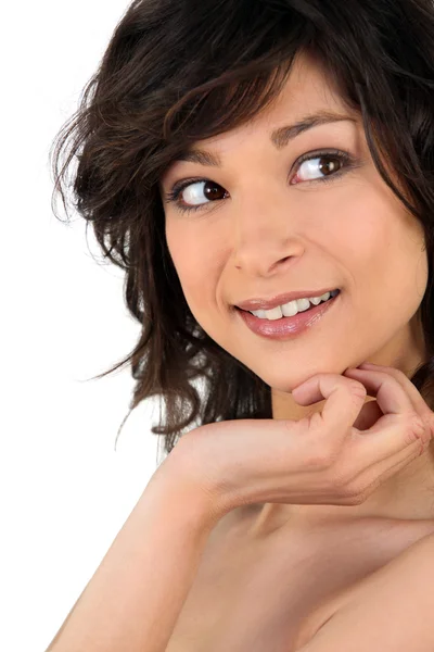 Pensive bare-shouldered brunette — Stock Photo, Image