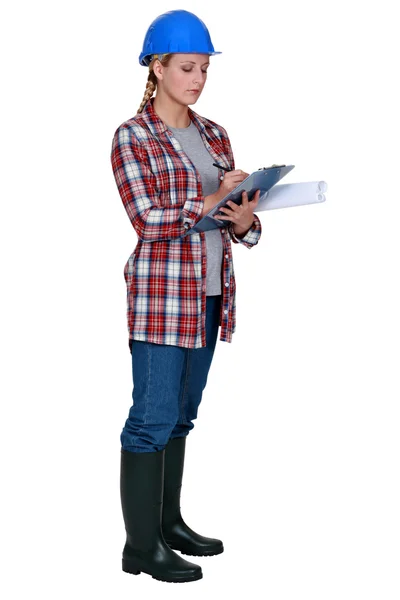 Female site surveyor with clipboard — Stock Photo, Image