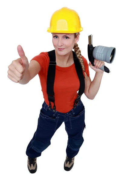 Kvinna anläggning-blåslampa — Stockfoto