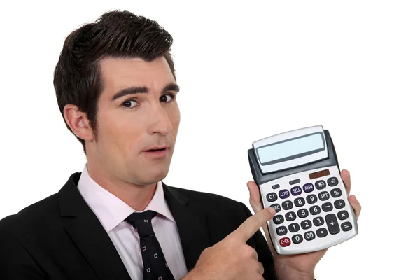Elegantní podnikatel prezentující kalkulačka — Stock fotografie