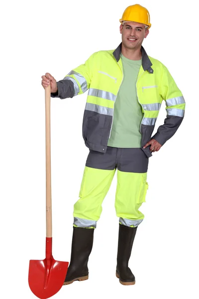 Craftsman holding a shovel — Stock Photo, Image