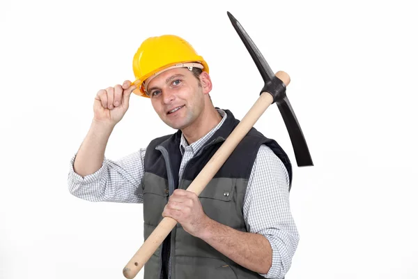 Man with ax tipping helmet — Stock Photo, Image