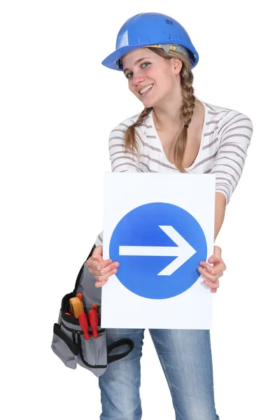 Woman holding traffic sign — Stock Photo, Image