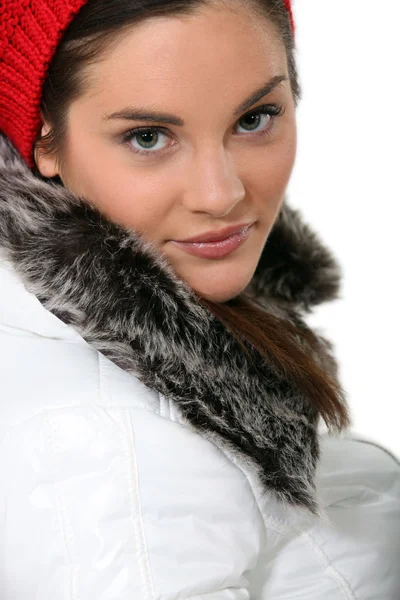 Pretty young woman wearing coat with fur — Stock Photo, Image