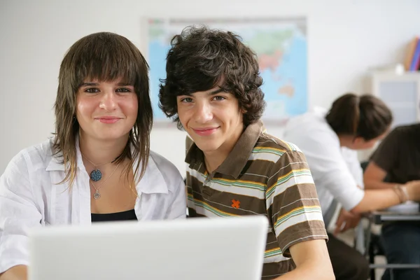 Teenage pupils in class — Stock Photo, Image