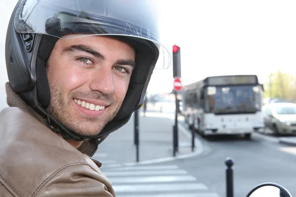 stock image Man on scooter at traffic lights