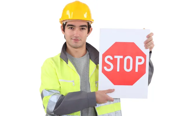 Arbetare med stoppskylt — Stockfoto
