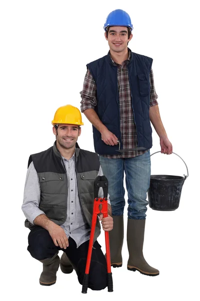 Dos trabajadores manuales colaborando — Foto de Stock