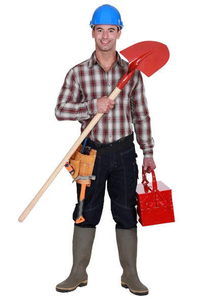 Ручной рабочий держит лопату — стоковое фото