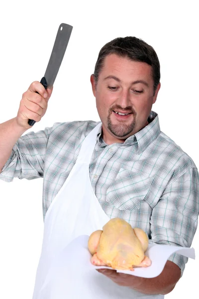 Slager snijden kip — Stockfoto
