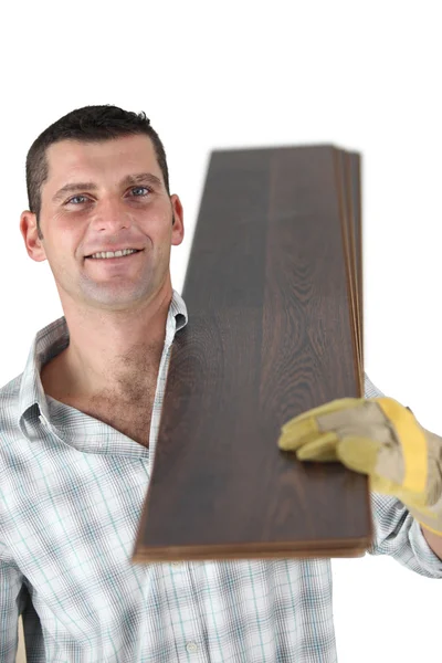 Craftsman carrying wooden boards — Stock Photo, Image