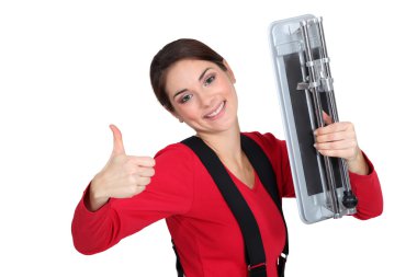 A female tiler giving the thumb up. clipart