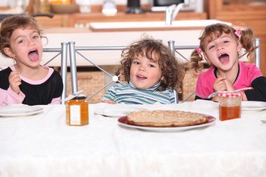 Children eating a pie clipart