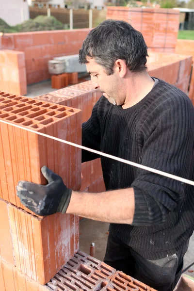 stock image Bricklayer building wall