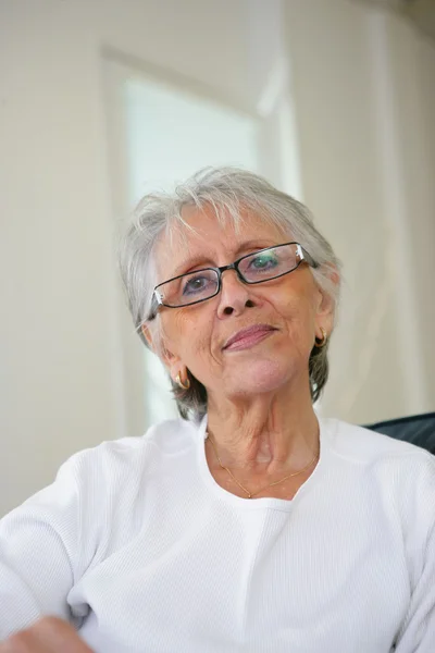 Elderly lady relaxing at home — Stock Photo, Image
