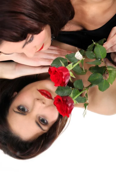 Frau in der Hand einer Rose — Stockfoto