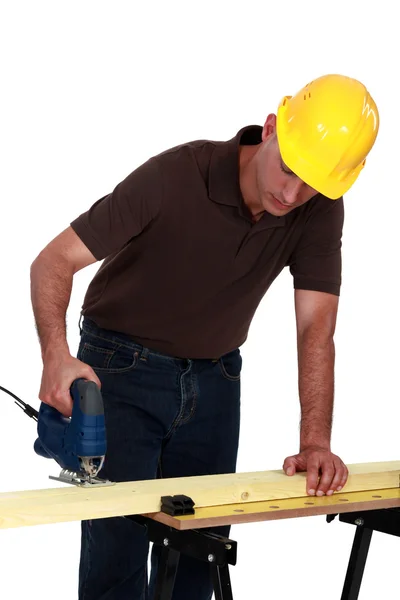 Tradesman using a jigsaw — Stock Photo, Image