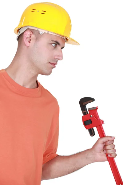 Craftsman holding a spanner — Stock Photo, Image