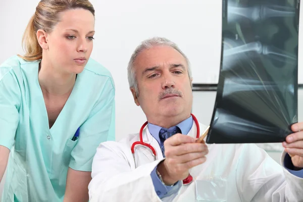 Doctor and his assistant — Stock Photo, Image