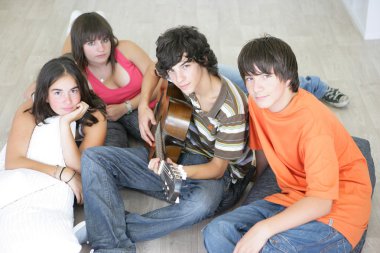 Young with a guitar clipart