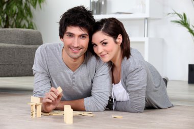 Couple playing dominoes clipart