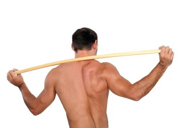 Man stretching with wooden pole clipart