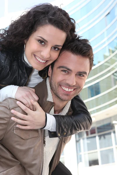 Young woman on her boyfriend's back — Stock Photo, Image