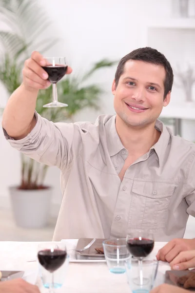 Man raising his glass for a toast — Stock Photo, Image