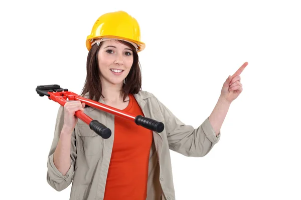 Woman with bolt-cutters pointing — Stock Photo, Image